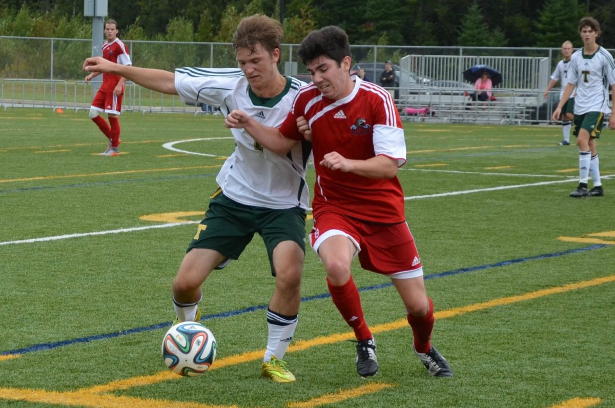 The STU Tommies men’s soccer team, in white, fell 4-0 to the UNBSJ Seawolves, in dark uniforms, on Sunday at Scotiabank Park South. Photo: Nathan DeLong/The AQ