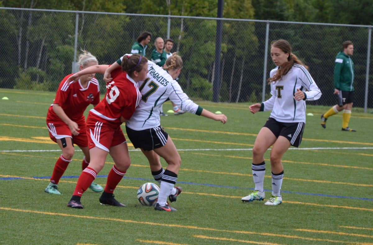 The St. Thomas Tommies women's soccer team, in white, battled to a 2-2 tie against the UNBSJ Seawolves on Sunday. Photo: Nathan DeLong/The AQ