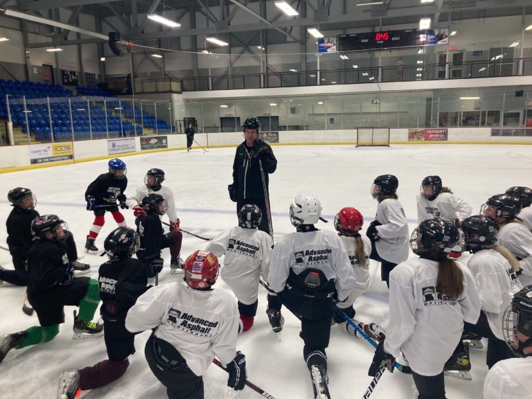 STU hockey team on year 23 supporting Fredericton hockey school